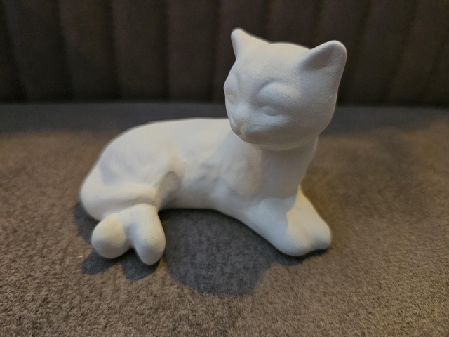 Aromasteen poes zittend