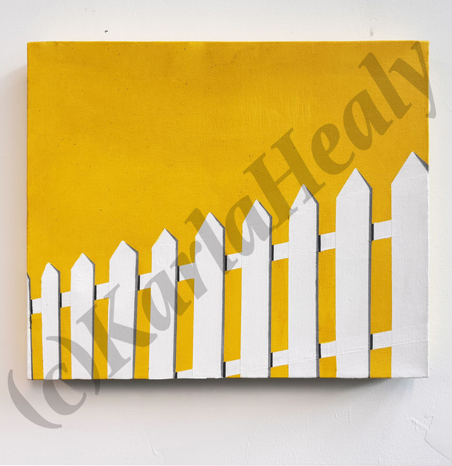 White picket fence on yellow