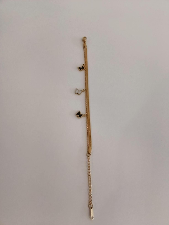 Zwart en zilver vlinder goudkleurig