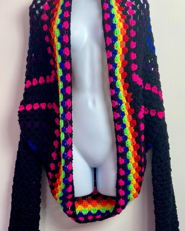 Rainbow and black shrug style cardigan.