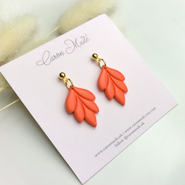 Coral and gold floral shape earrings