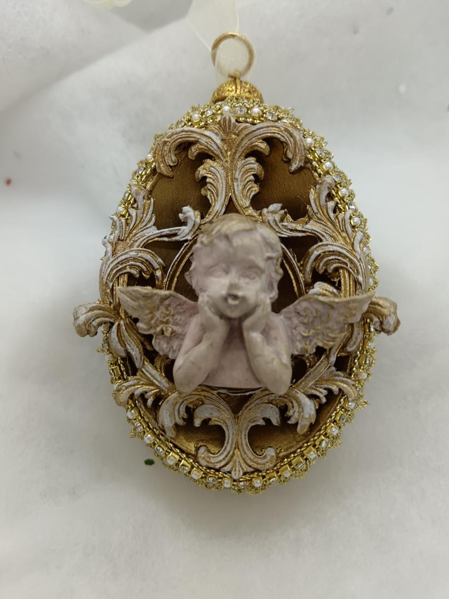 Angel on a gold goose egg 