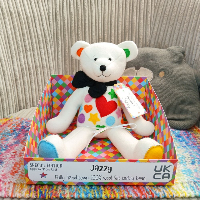 Jazzy. Special Edition, handmade teddy bear. UKCA. Tray base packaging. Spots. Heart. Star.. White. Yellow. Red. Pink. Purple. Blue. Green. Black. 