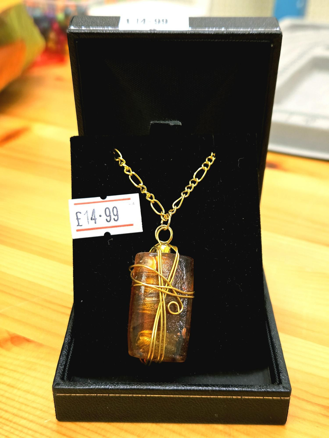 Gold wire wrapped amber glass necklace