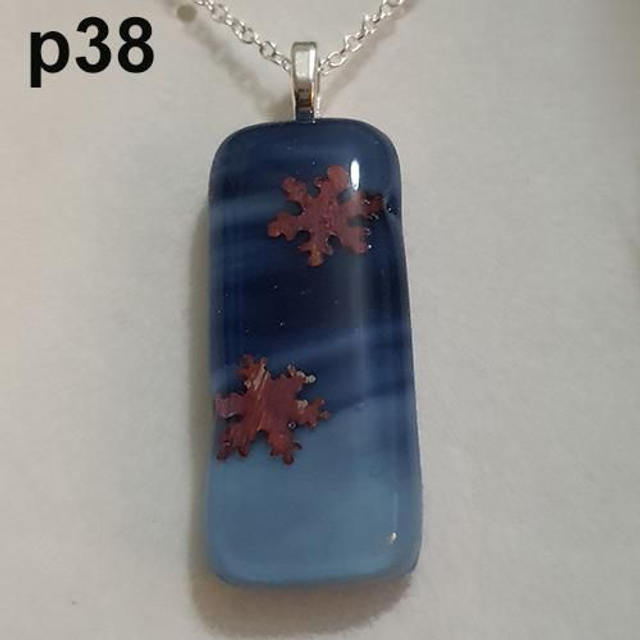 Copper snowflakes on whispy blue glass pendant with chain p38