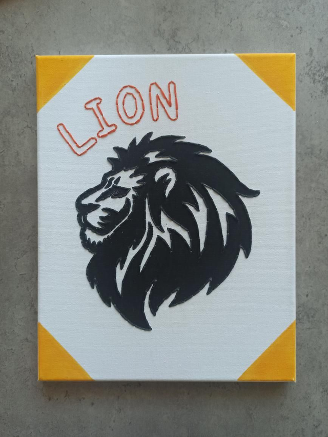 Toile brodée signe astro Lion