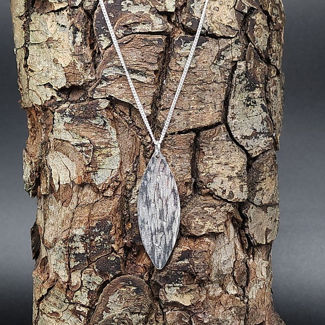 Textured long oval pendant 