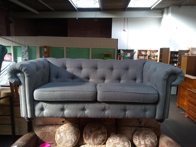 Grey chesterfield style sofa