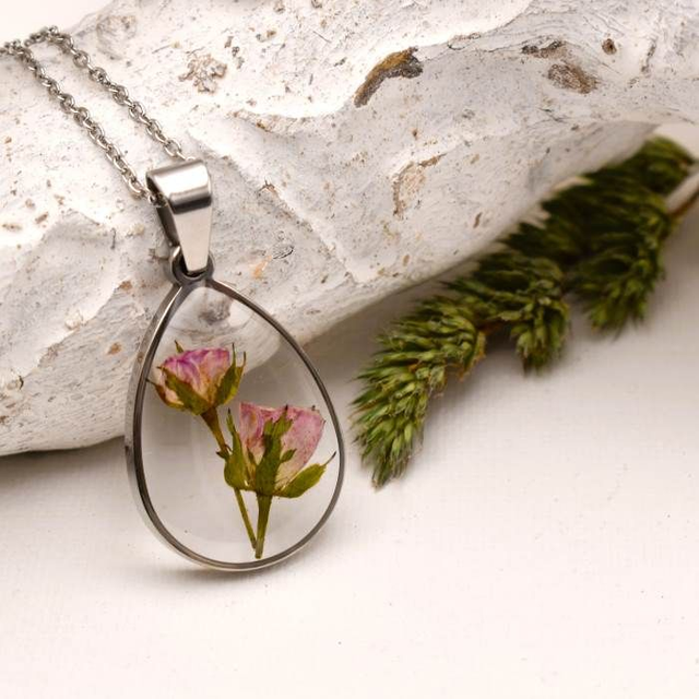 Tiny pink rosebuds in drop pendant