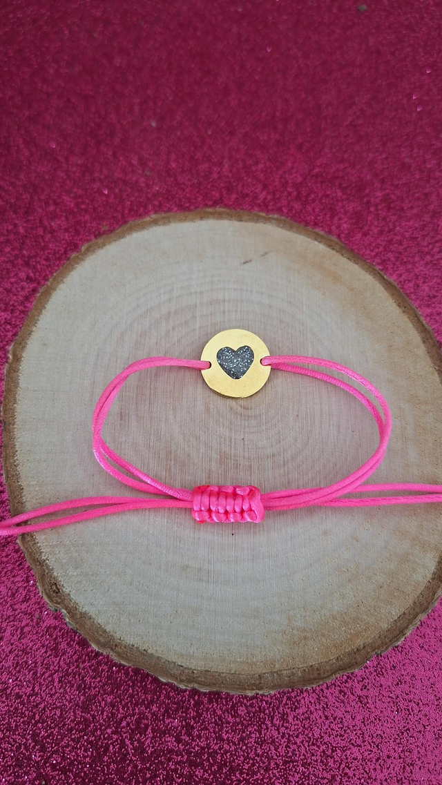 Bracelet cordon rose fluo cœur paillettes noires blanches dorées 