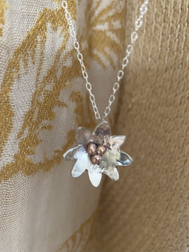 Lilly in hammered sterling silver with copper detailing