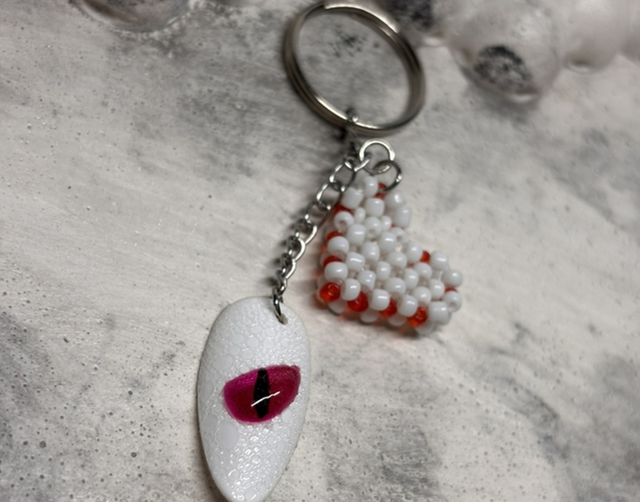 Porte-clé œil dragon blanc