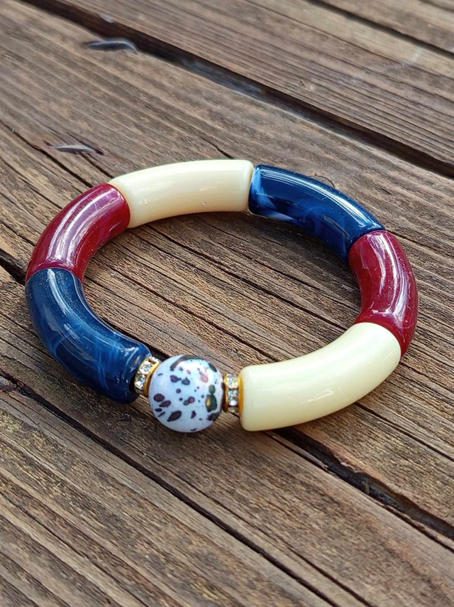 Bracelet perles tubes incurvées acrylique Uma Fraans