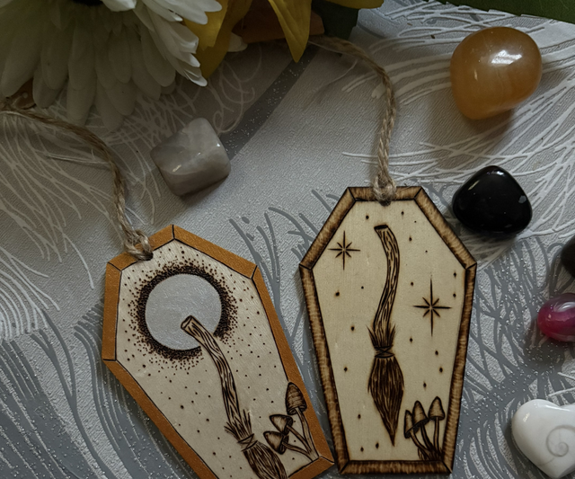 Hand burnt broom designs on a coffin shape 