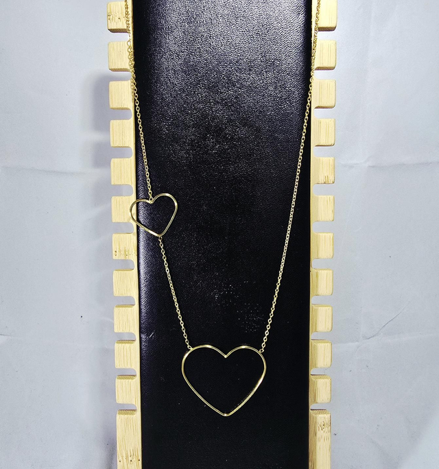 Collier "Marcia" en acier doré et 2 coeurs creux