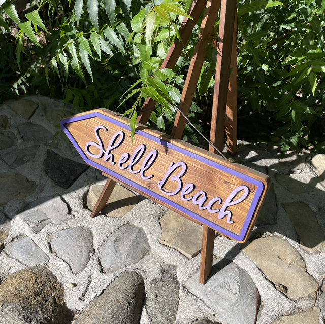 Panneau de signalisation « Shell beach »