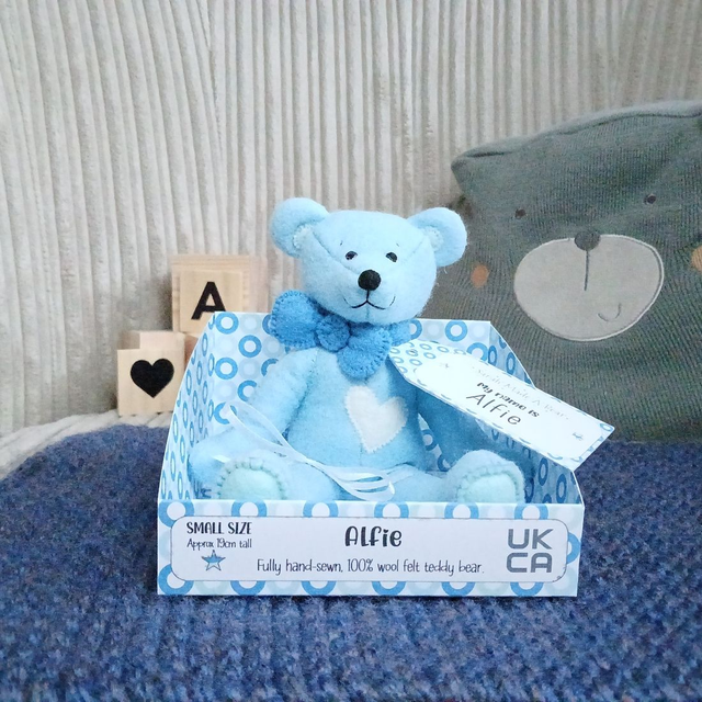 Alfie. Small size, handmade teddy bear. UKCA. Tray base packaging. Standard Wool Felt. Baby blue. Mid blue. Spearmint. White. 