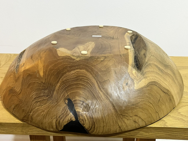 Fruit bowl made from teak tree root.