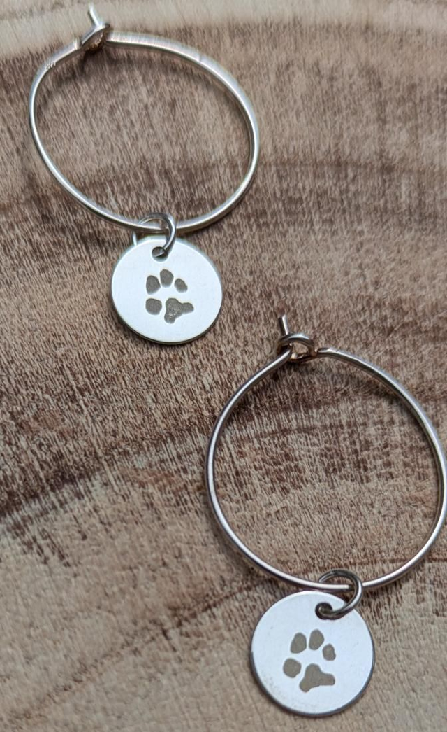 Sterling silver hoop earrings with dog paw charm