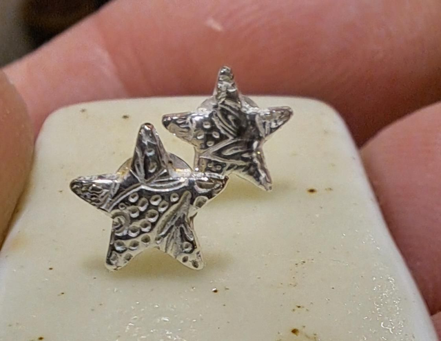 Silver star studs abstract design 
