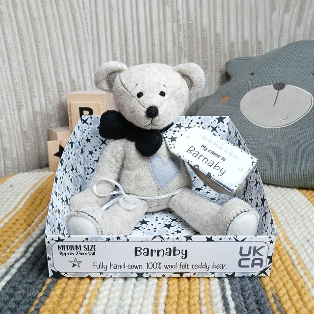 Barnaby. Medium size, handmade teddy bear. UKCA. Tray base packaging. Standard Wool Felt. Black. Grey. White.