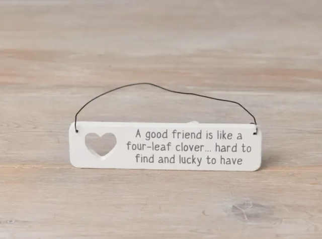 A good friend is like a four- leaf clover wooden sign 