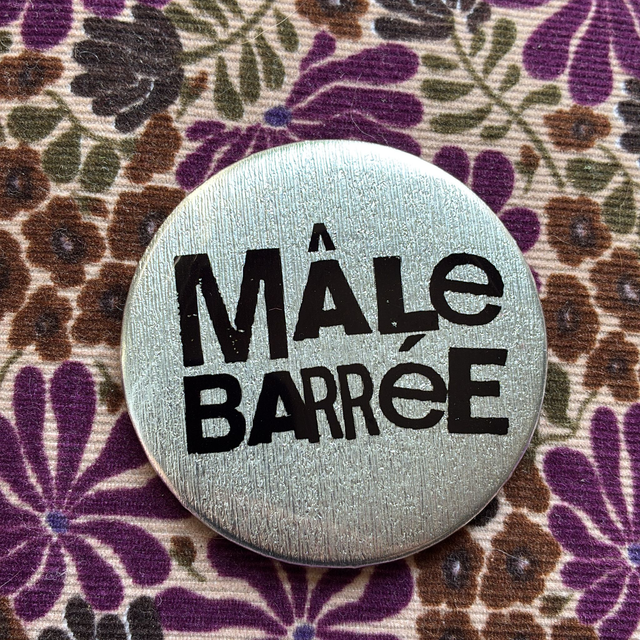 Badge Mâle Barrée