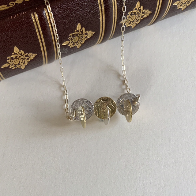 Silver and brass pendant