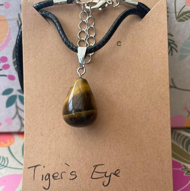 Tigers eye necklace on 17”-19” Black leatherette cord
