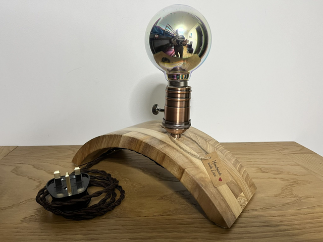 Stylish decorative lamp made of Paulownia wood with a 3D light bulb.