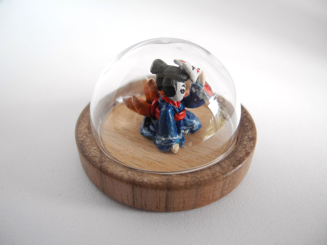Kitsune disguised as Geisha in a Kimono adorned with waves - miniature pendant for Japan enthusiasts