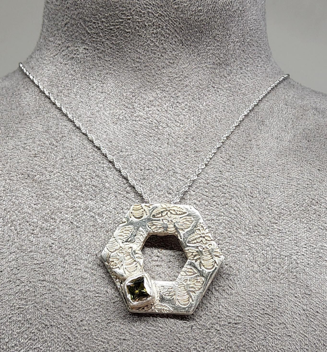 Hexagon bee textured with peridot cubic zirconia pendant on silver necklace