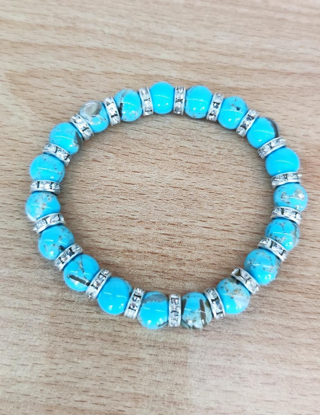 Bracciale con perline azzurre e distanziatori