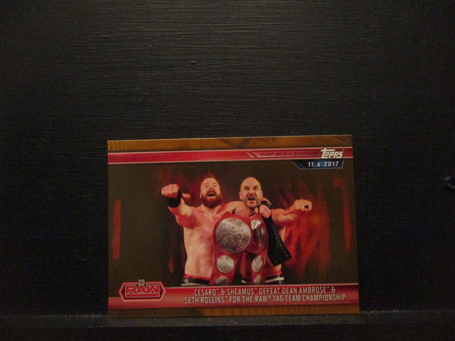 Cesaro &amp; Sheamus Defeat Dean Ambrose &amp; Seth Rollins For The Raw Tag Team Championship - Brown Champions Original Trading Card #9