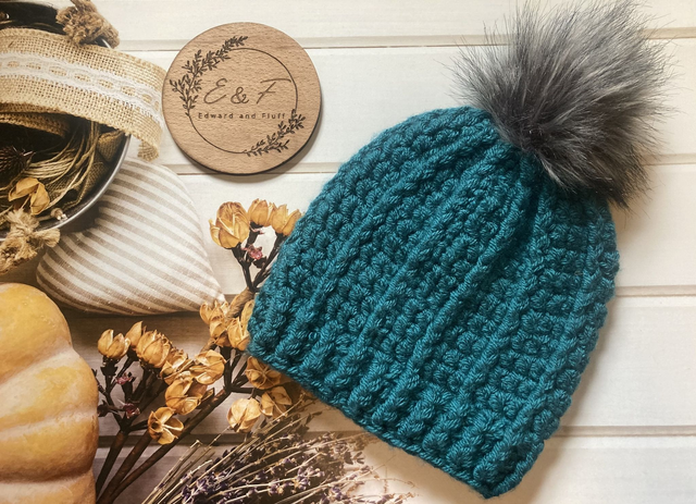 Handmade hat in a  teal green colour. Child size crochet hat.