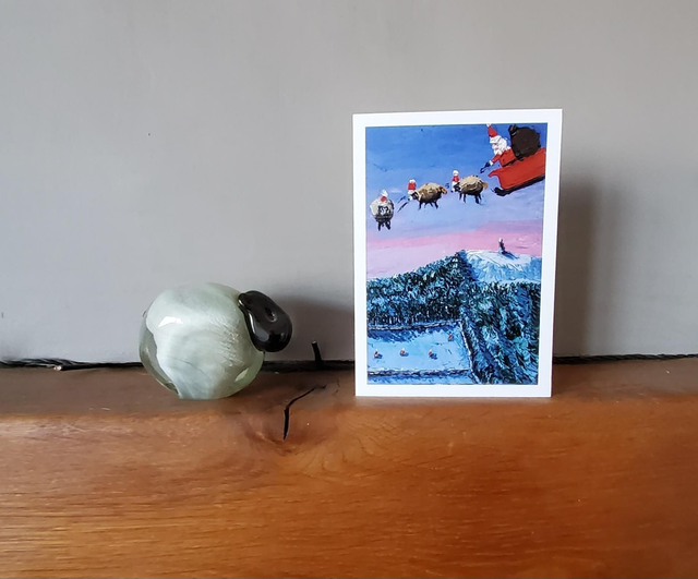 Father Christmas and his flying sheep over Captain Cook&#039;s Monument, North York Moors. A6 card. 