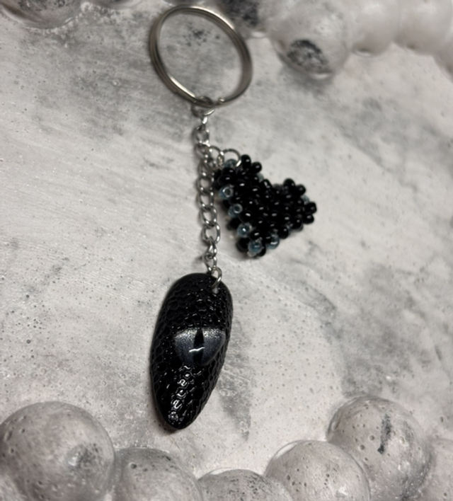 Porte-clé œil dragon noir