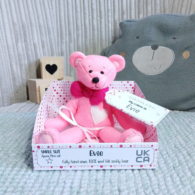 Evie. Small size, handmade teddy bear. UKCA. Tray base packaging. Standard Wool Felt. Bright pink. White. Baby pink. Magenta.