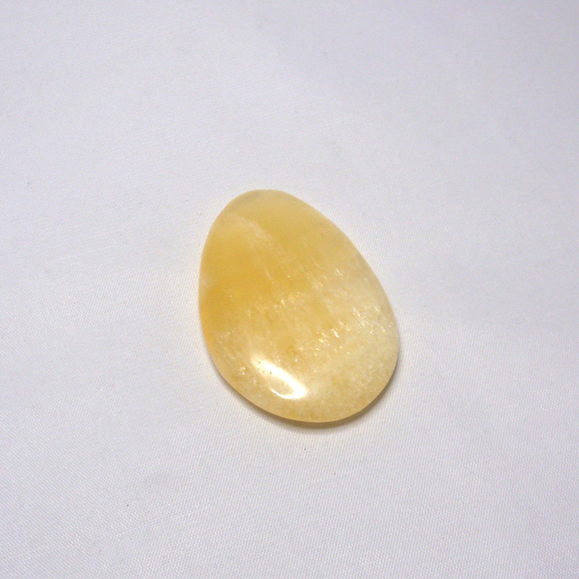 Orange Calcite pocket stone