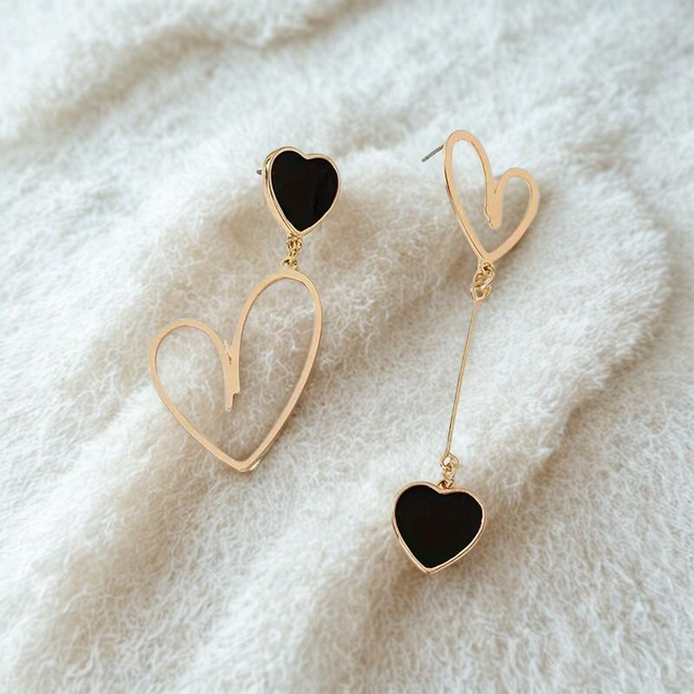 Boucles d’oreilles asymétriques double cœur