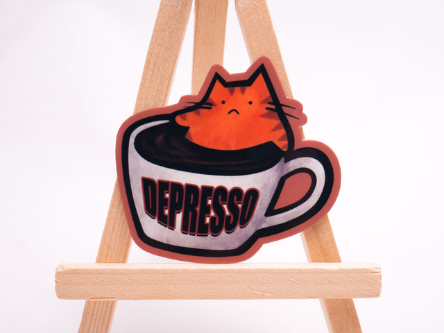 Naklejka DEPRESSO wlepa z rudym kotem w kawie