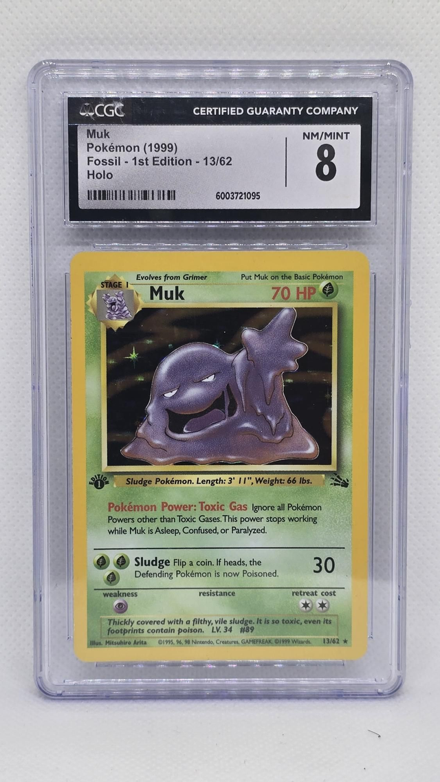MUK , 1999 FOSSIL- 1ST EDITION HOLO [CGC 8]