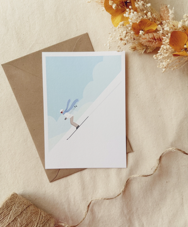 Carte Skieuse à écharpe bleue