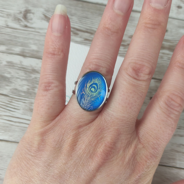 Bague acier &quot;bleue et plume paon&quot; réglable