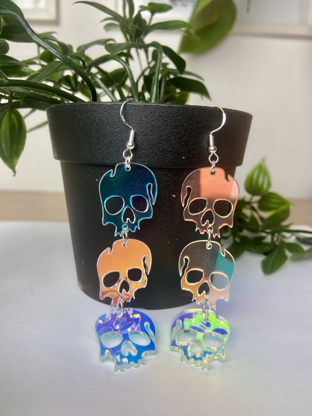Mirrored skull earrings.