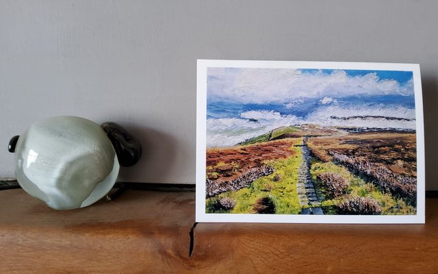Walker on the Cleveland way over Scarth Wood Moor, Osmotherley. Art card.