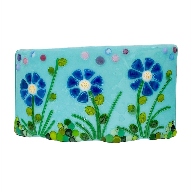 Curved fused glass ornament with blue flowers (Ref CSBF 1)