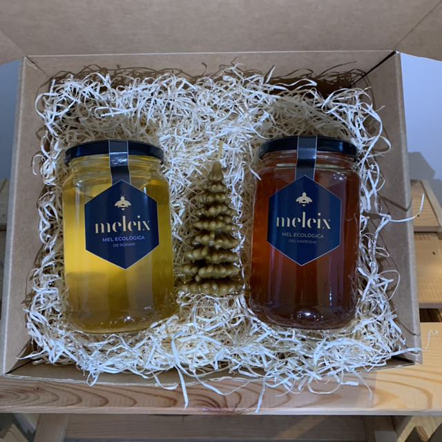 Capsa regal amb dos pots de mel i una espelma