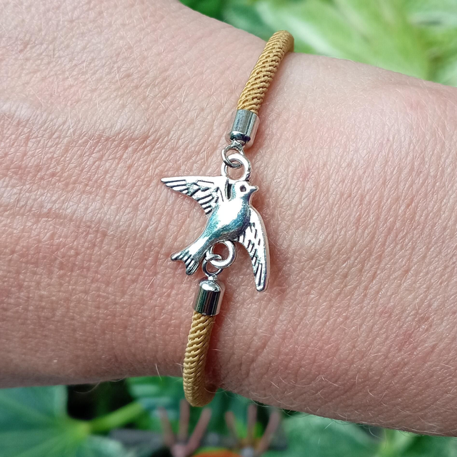 Gold kids bracelet with a Bird Charm
