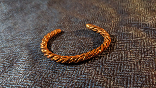 Complicated little copper arm ring